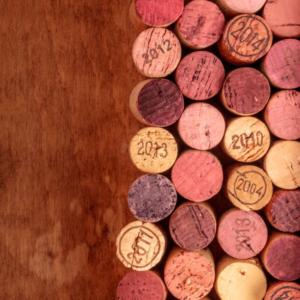 istock Wine corks background, overhead photo of red and white wine corks with copy space 1041579742