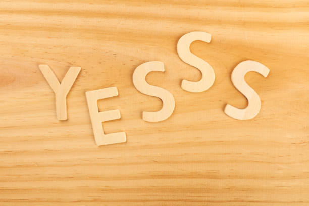 istock Yes, letters forming word on a wooden background with copyspace 1041579966
