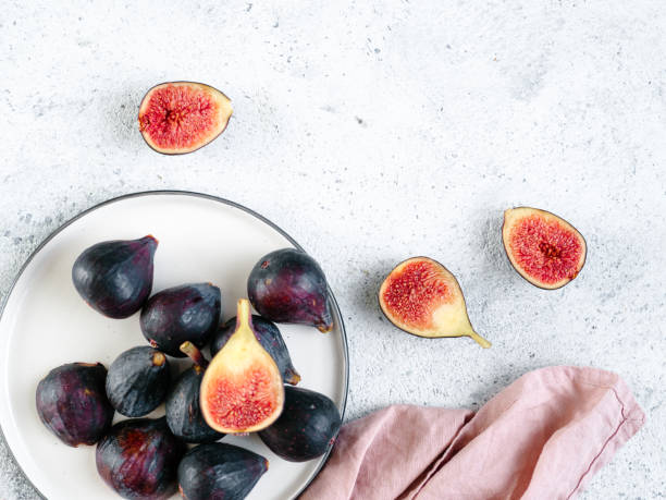istock Whole and half figs isolated topview 1041591526