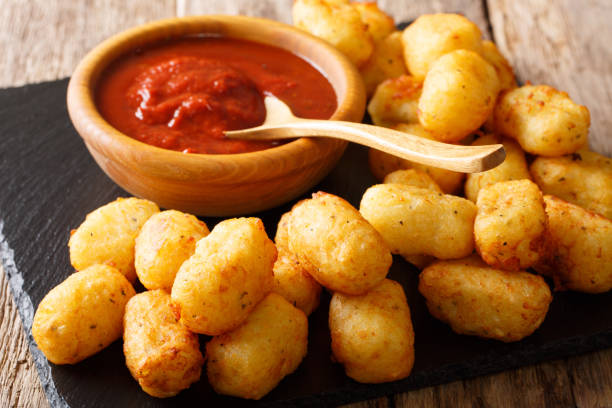 istock Deep-fried Potato Tater Tots and ketchup close-up. horizontal 1041601730