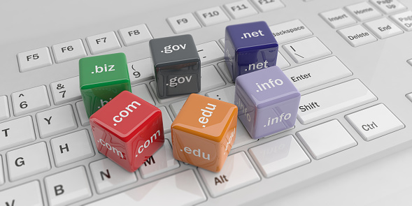 3d rendering cubes with domain names on a white keyboard