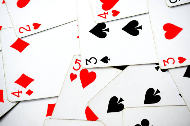 istock Playing cards scattered on the table as a background 1041607768