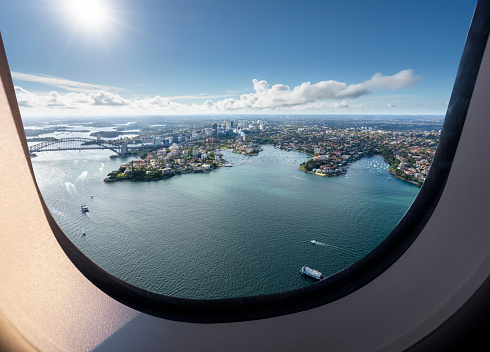 aircraft window view of sydney harbor bridge,australia.