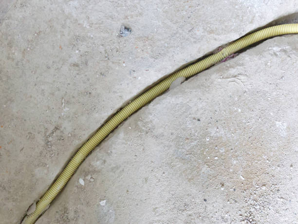 istock New electricity pipe in a concrete floor 1041623288