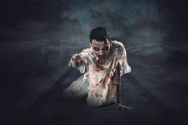 istock Scary male ghost is crawling in the cemetery 1041623644