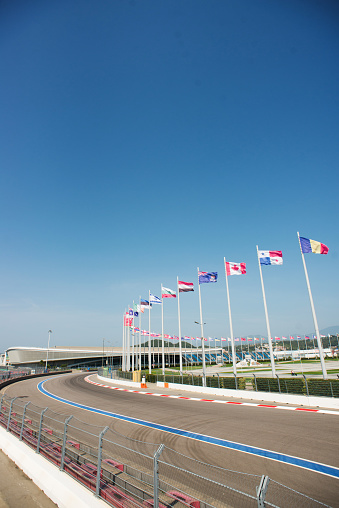 Sochi, Russia - September 6, 2018: Part of Sochi Autodrom with Flags Different Countries. Track f1 wich Located in Olympic Park in Adler.