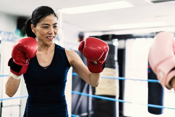 istock Two women training at boxing gym 1041630822