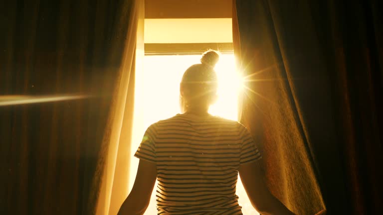 Woman relaxing in front of the window.