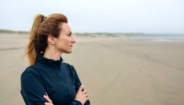 istock Woman looking at sea 1041634120