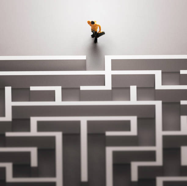 istock Miniature people entering a maze. Problems in Life  concept. 1041634974