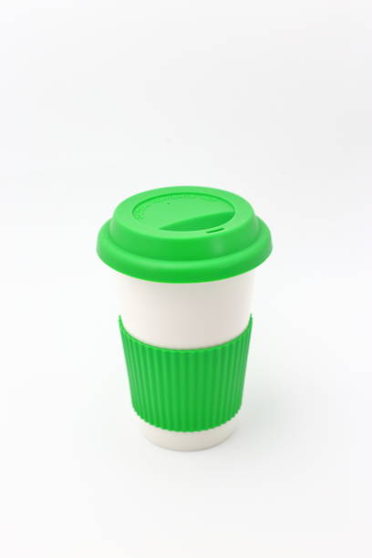 istock White porcelain container for coffee or hot drinks covered with its green lid 1041644686