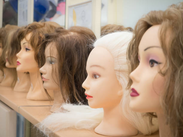 istock Wigs on mannequin heads in a row. 1041649848