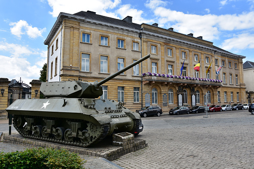 Arlon, Belgium - July 18, 2018: American tank from World War II situated on Leopold square - this is Arlon’s Liberty Roar monument / Borne de la voie de la liberte /