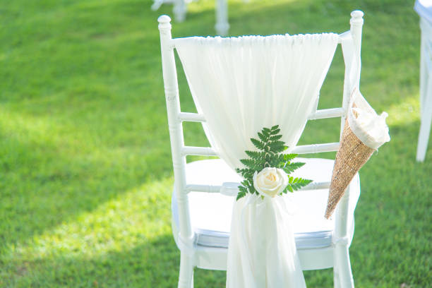 istock Chair decorated with flowers in Wedding ceremony. 1041652814