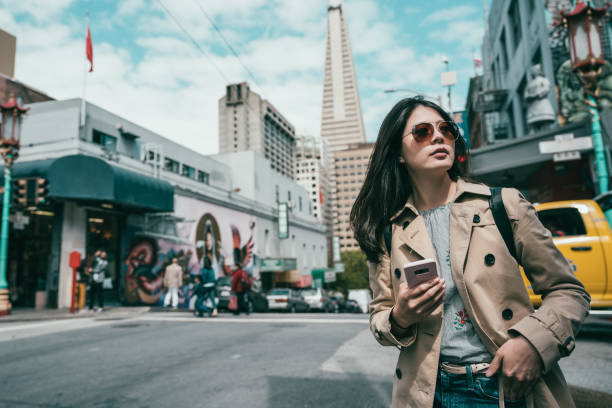 istock woman looking confident and using smart phone 1041657390
