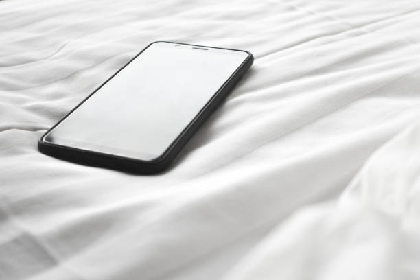 istock smartphone on bed,phone addict concept. 1041657396