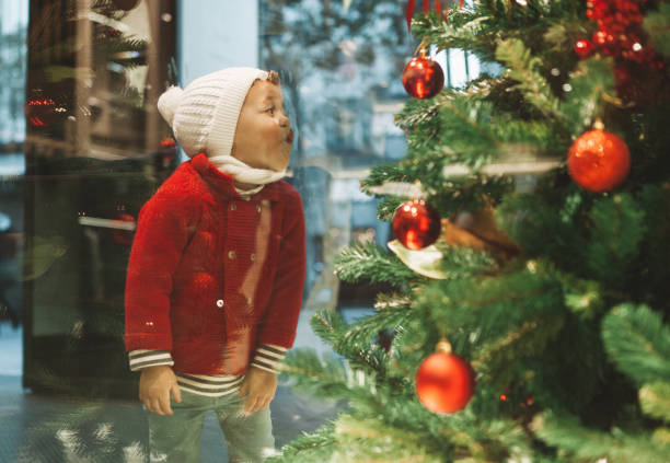 Boy window shopping during christmas