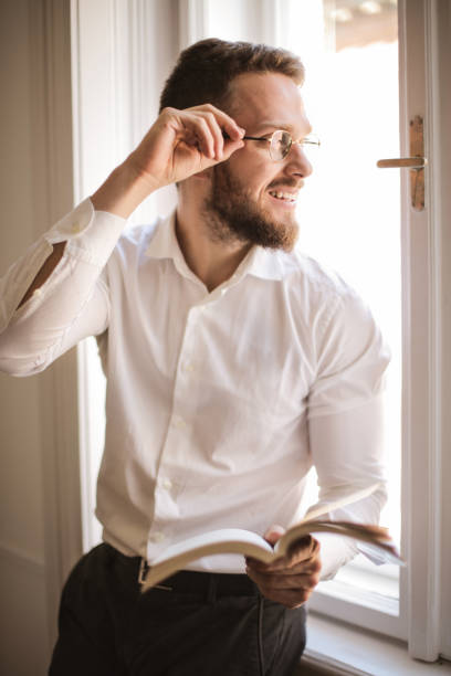 istock Handsome man near the window 1041657838