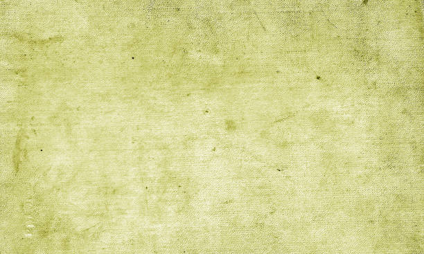 istock Old grungy canvas pattern with dirty spots in yellow tone. 1041663002