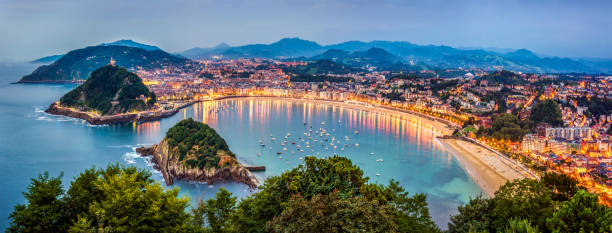 Panoramic view of Donisti san sebastian at sunset. Euskadi, Spain View of Donosti San Sebastian at Dusk from Monte Igueldo. Basque Country. Spain spain stock pictures, royalty-free photos & images