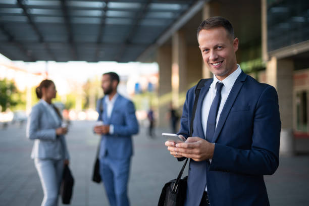 istock Young businessman reading text message on mobile phone 1041674626
