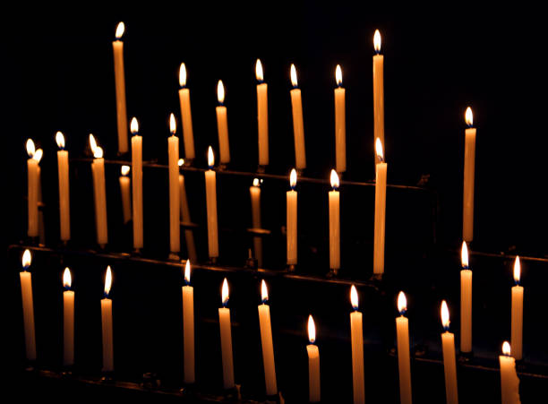 istock candles with flames in the church 1041675774