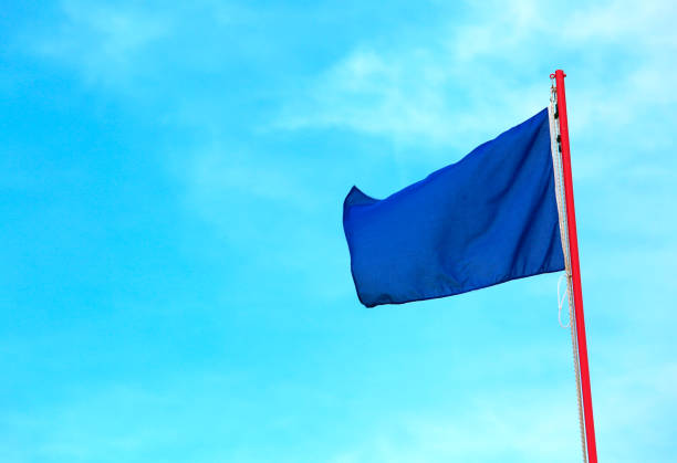 istock blue flag on the blue sky this is a symbol indicates clean sea 1041676074