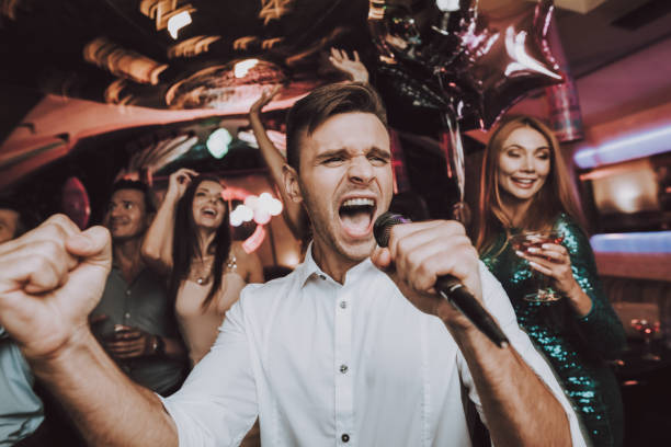 istock Sing. Men. Microphone. Great Mood. Dance Club. 1041685120