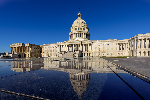 Panoramic view of Capitol Building with reflection in the morning, Washington DC