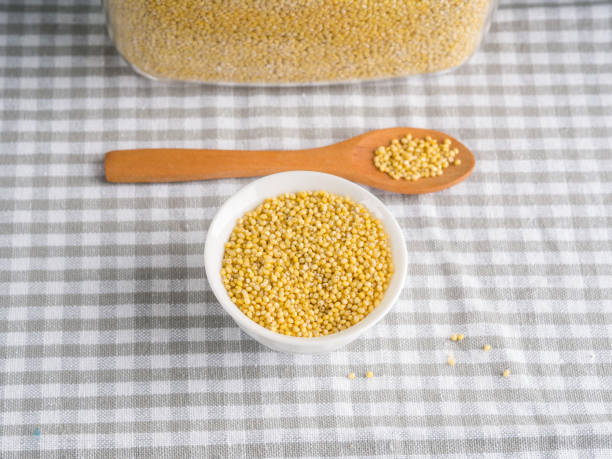 istock Gluten free grain millet in bowl on kitchen table 1041688208