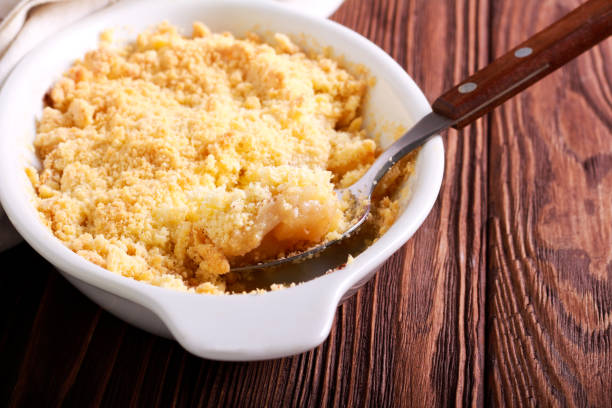 istock Apple and cinnamon crumble cake in baking tin 1041695548
