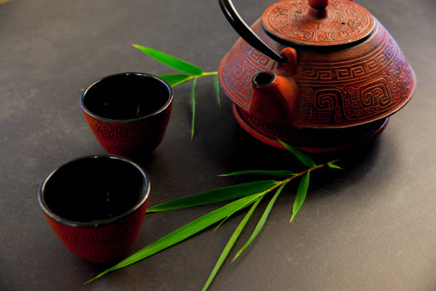 istock Oriental iron teapot with green tea 1041701190