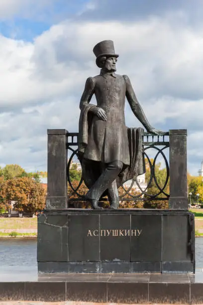 Monument to Russian poet Alexander Pushkin on the embankment in Tver, Russia. Volga river embankment. Autumn day. Picturesque landscape.
