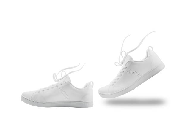 istock Pair of White sneaker composition like walking and floating rope  isolated on white background with clipping path 1041705482