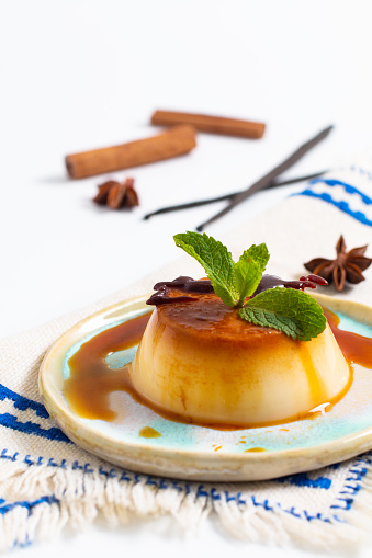 Food Dessert concept homemade vanilla Caramel custard or panna cotta with vanilla beans and spices on white background