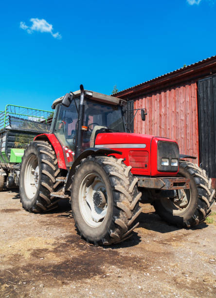 istock Tractor with a trailer for hay on the farm. 1041727142