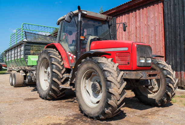 istock Tractor with a trailer for hay on the farm. 1041727150