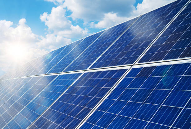 istock Blue solar panels over blue sky. Renewable energy. 1041727226