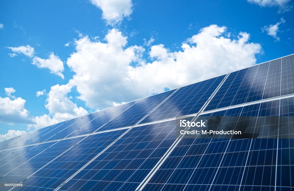 Blue solar panels over blue sky. Renewable energy. Solar Panel Stock Photo