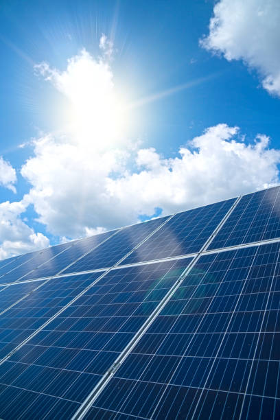 istock Blue solar panels over blue sky. Renewable energy. 1041727250