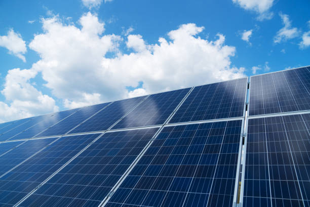 istock Blue solar panels over blue sky. Renewable energy. 1041727290