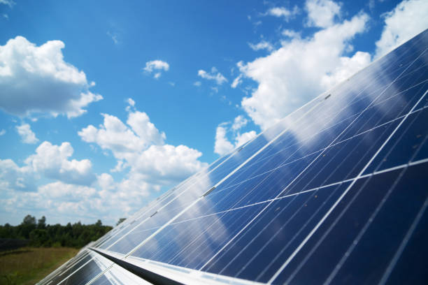istock Blue solar panels over blue sky. Renewable energy. 1041727306