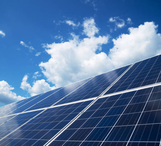 istock Blue solar panels over blue sky. Renewable energy. 1041727372