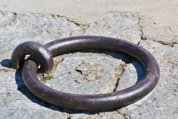 Closeup of a steel ring on the pier used for anchoring boats