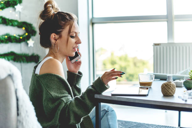 istock Smiling woman talking on the phone 1041730264