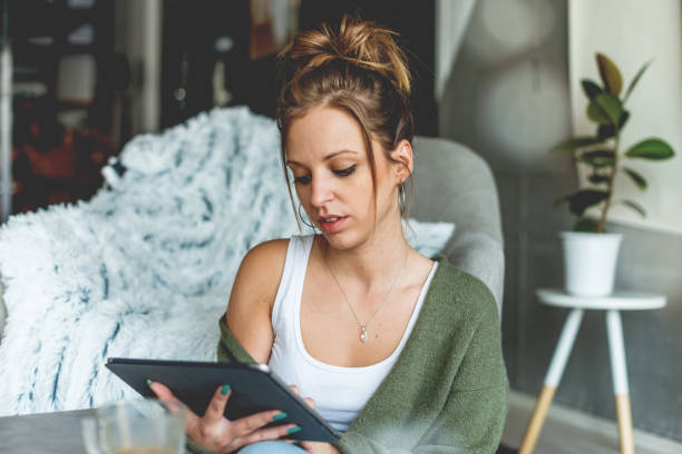 istock Young women typing on digital tablet 1041730602