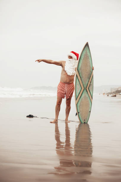 istock Santa Claus with surf board 1041738700