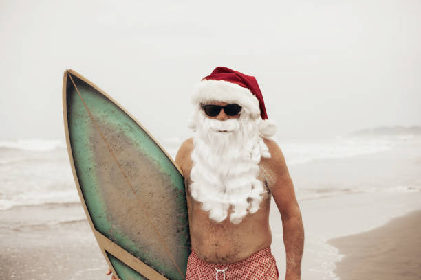 istock Santa Claus with surf board 1041739072
