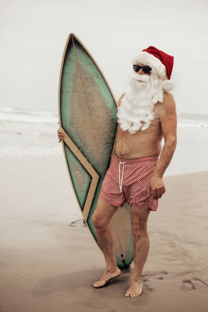 istock Santa Claus with surf board 1041739074