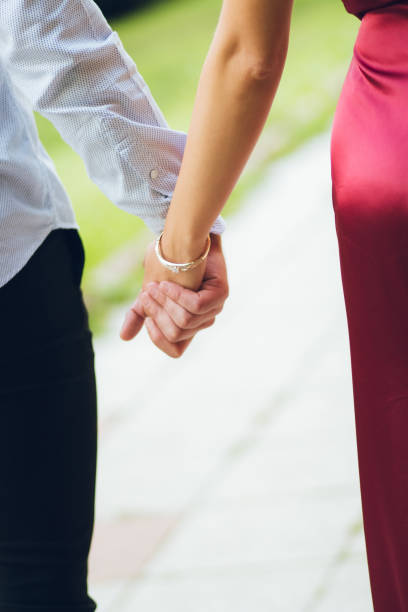 istock Elegant Couple Holding Hands 1041743798